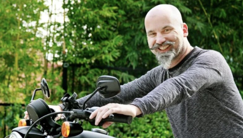 Dru Morgan, the Window Dude, on his motorcycle